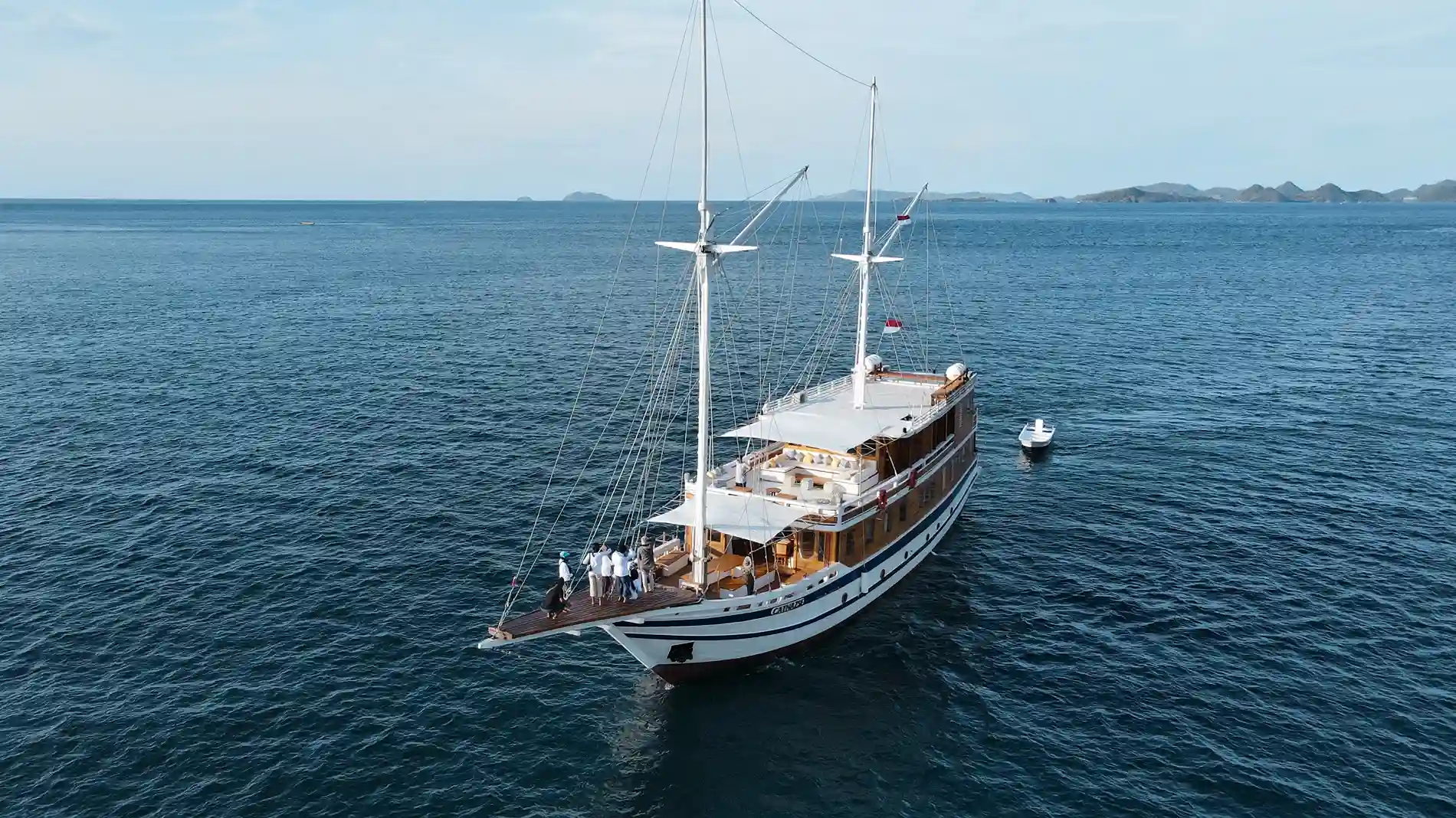 A phinisi at sea in the last of the evening light